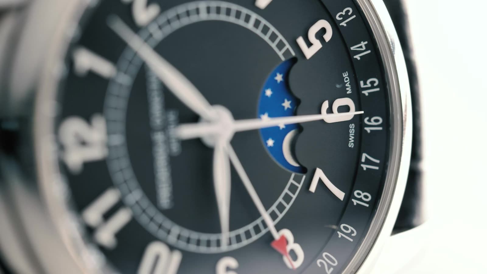Close view of a round wristwatch on a wrist