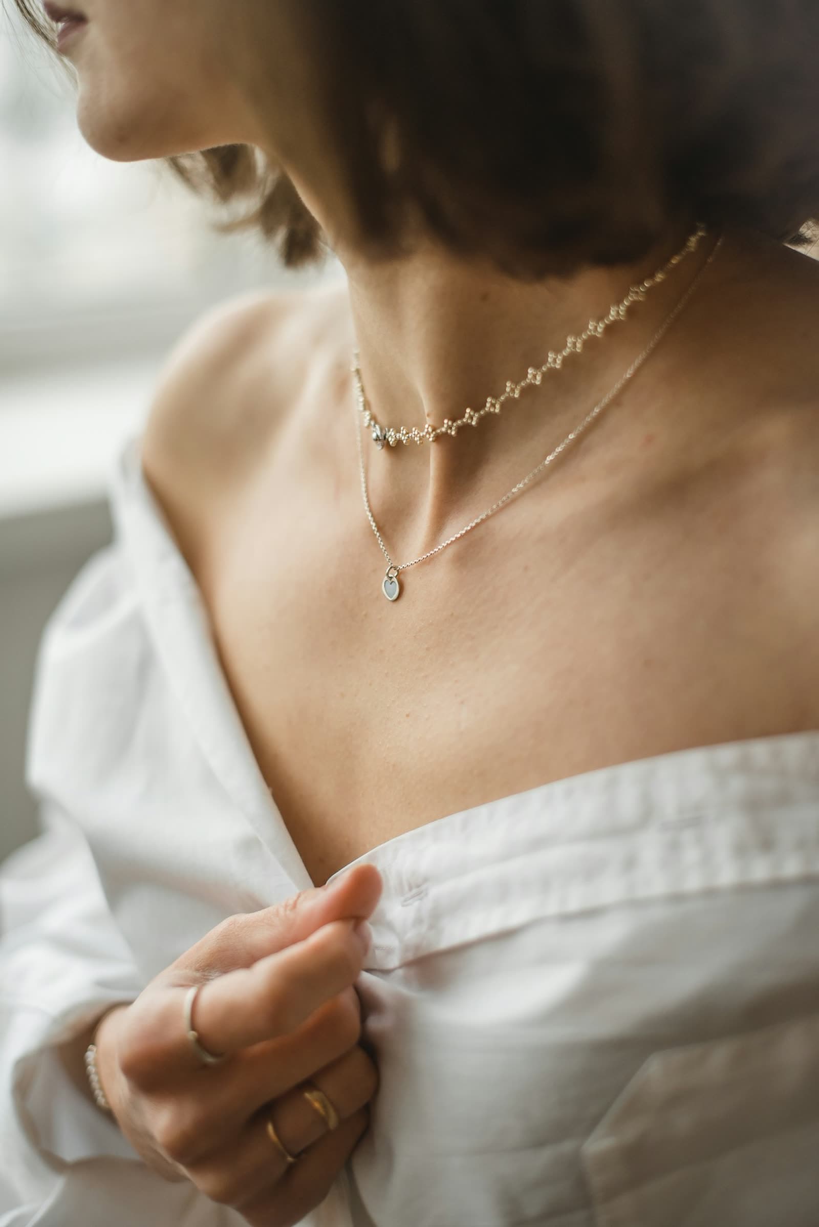 A round dress watch resting on an open book